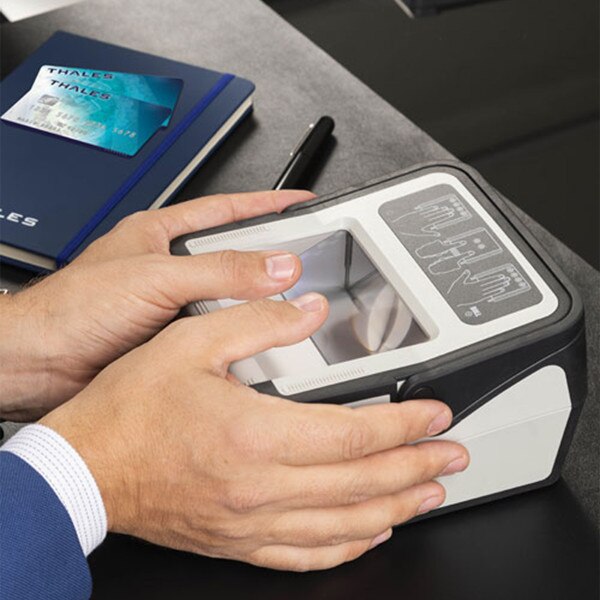 two thumbs on scanner